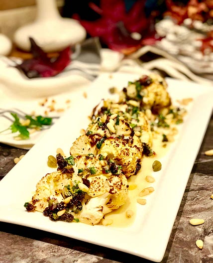 Seriously good chunky roasted cauliflower with capers and raisins dressing