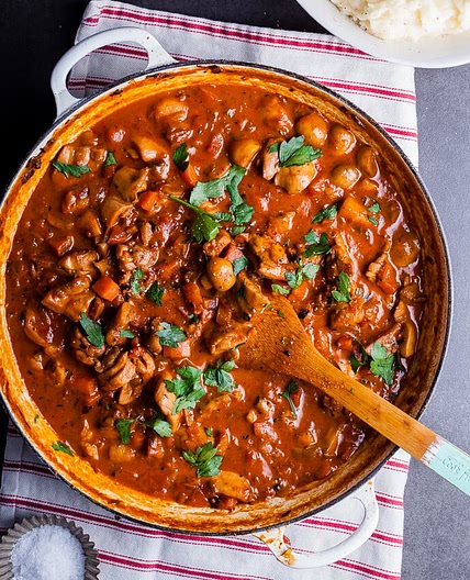 Chicken, tomato and mushroom stew with garlic Parmesan mash