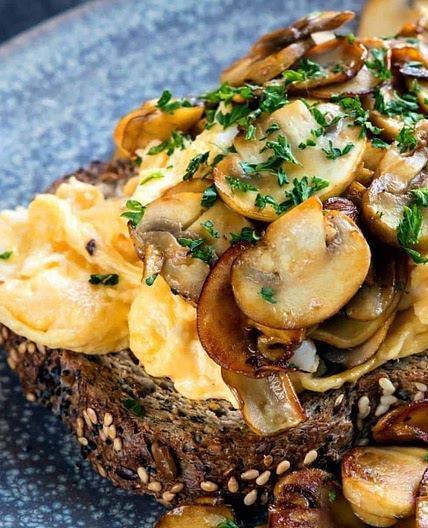 Creamy scrambled eggs with mushrooms