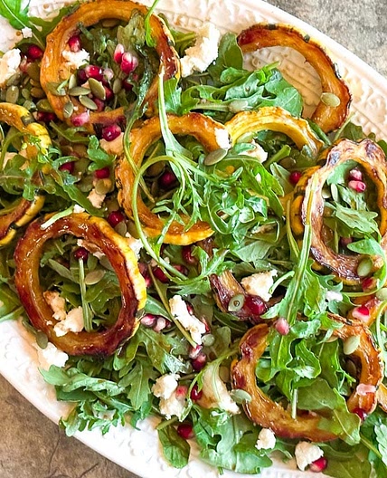 Roasted Delicata Squash & Arugula Salad with Goat Cheese and Pomegranate