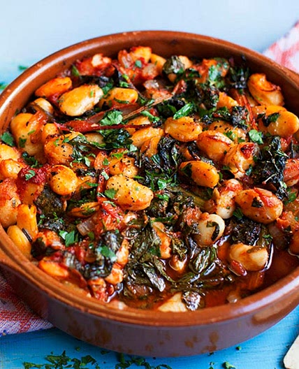 Gigantes with tomatoes and greens