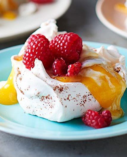 Star anise meringues with mango coulis & raspberries