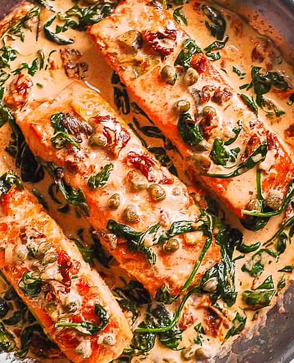 Creamy Tuscan Salmon with Spinach, Artichokes, and Garlic