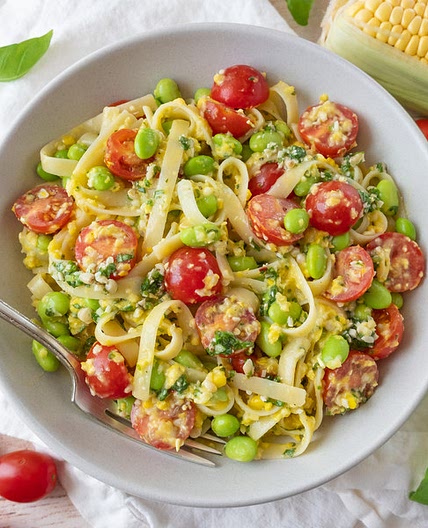 Creamy Corn Fettuccini with Edamame, Tomatoes & Basil Pesto