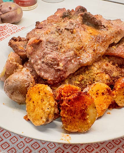 Parmesan Crusted Potatoes and Pork Steak Sheet Pan Meal