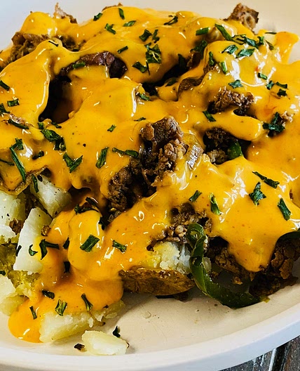 Blackstone Cheesesteak Loaded Potatoes