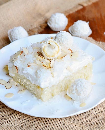 Raffaello Poke Cake: Coconut Cake with White Chocolate/Coconut Cream & Whipped Topping