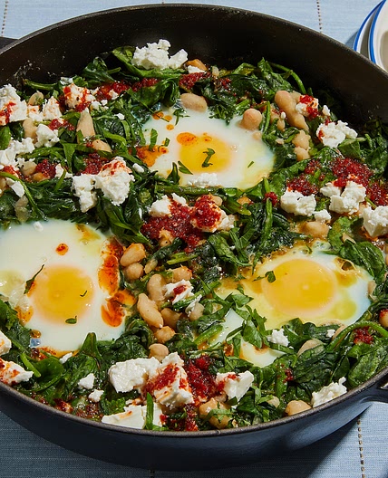 Green spinach shakshuka with white beans