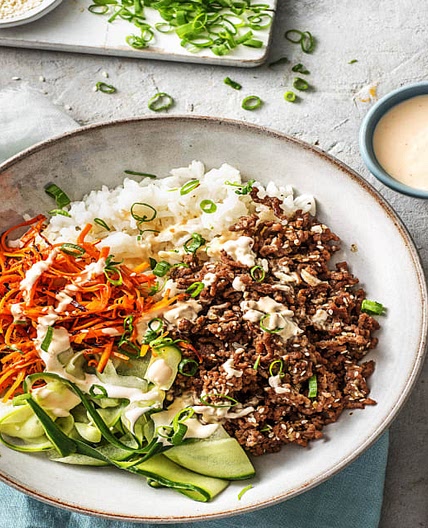 Ground Beef Bulgogi Bowls with Carrots, Cucumber, and Sriracha Crema over Jasmine Rice