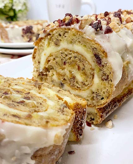 Banana Cream Cheese Cake Roll with Pecans Cranberries and Ginger