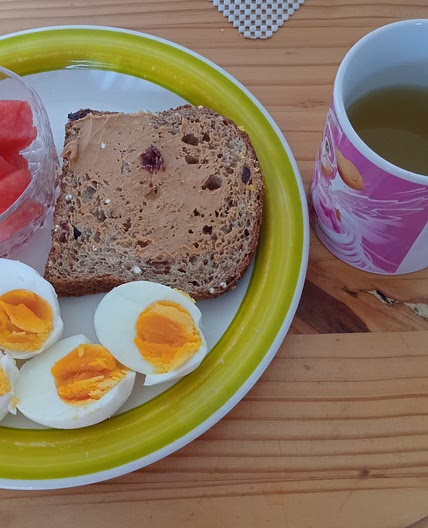 Boiled eggs with watermelon and peanut butter toast