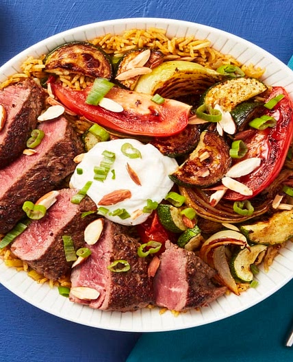 Middle Eastern Steak Bowls with Spiced Basmati Rice, Roasted Veggies & Lemon Garlic Yogurt Sauce