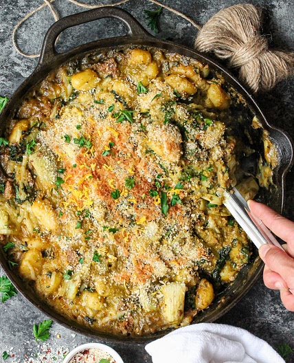 Skillet Baked Vegan Sausage, Kale and Artichoke Gnocchi with Pistachio Pesto