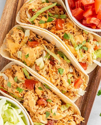 Slow Cooker Queso Chicken Tacos