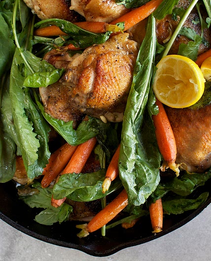 Skillet-Roasted Chicken Thighs With Dandelion Greens & Baby Carrots