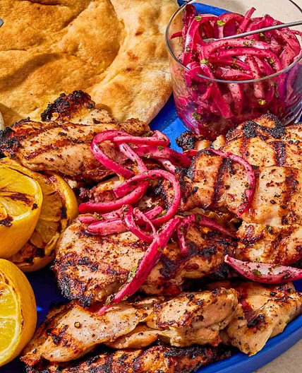Grilled Chicken Thighs with Sumac, Pickled Onions, and Charred Lemon