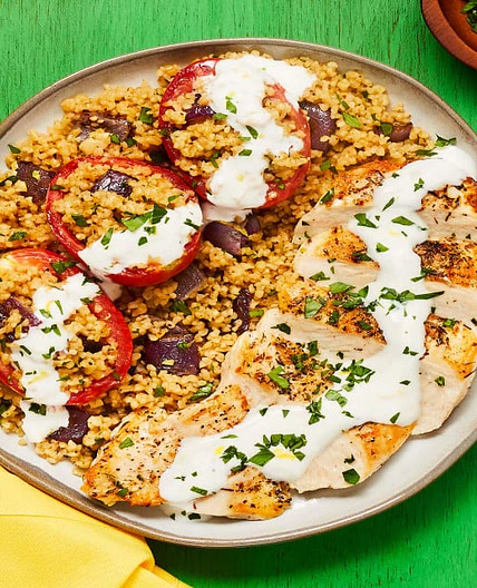 Za’atar-Spiced Chicken with Bulgur-Stuffed Roasted Tomatoes & Lemon Garlic Yogurt Sauce