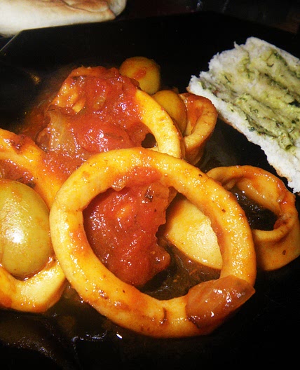 Squid Stewed With Tomatoes, White Wine and Black Olives