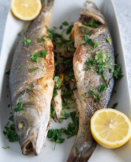 whole roasted branzino with lemon and fresh herbs