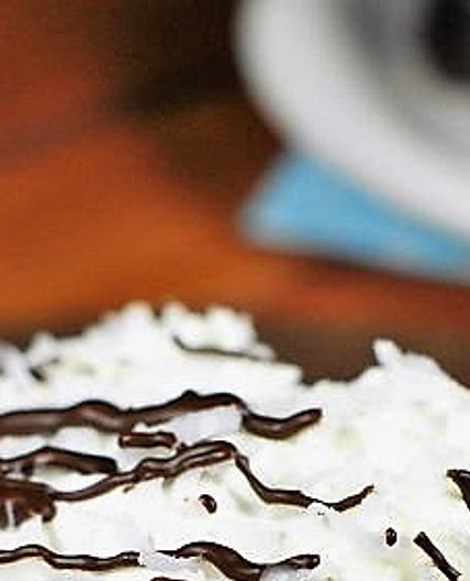 Coconut Chocolate Poke Cake {with Coconut Whipped Cream Frosting}