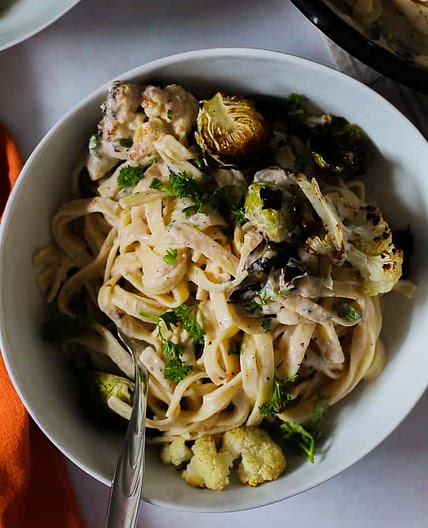 Creamy White Bean Pasta with Roasted Brussels Sprouts and Cauliflower