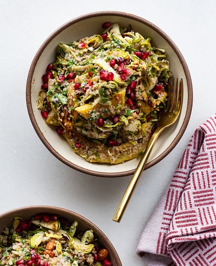 Shaved Brussels Sprouts Salad with Pomegranate Dressing & Chili Almonds