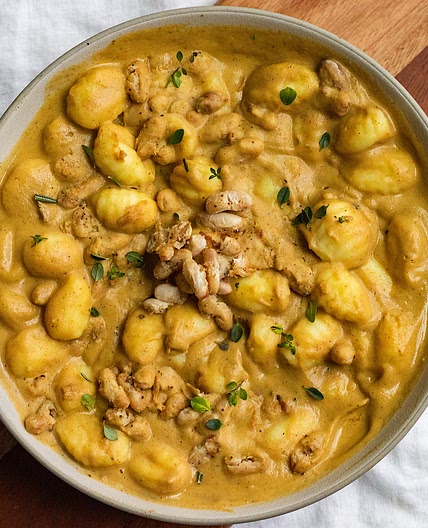 vegan creamy acorn squash gnocchi with crispy white beans