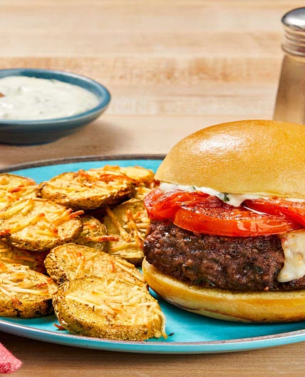 Mozz-Stuffed Caprese Burgers with Griddled Tomato, Basil Sauce & Parmesan Potato Rounds