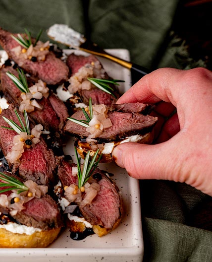 Venison Crostini with Whipped Goat Cheese & Pickled Shallots