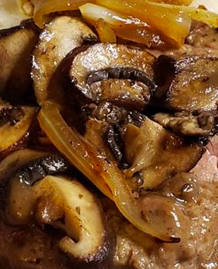 Smothered Steak and Mushrooms Over Creamy Grits Recipe