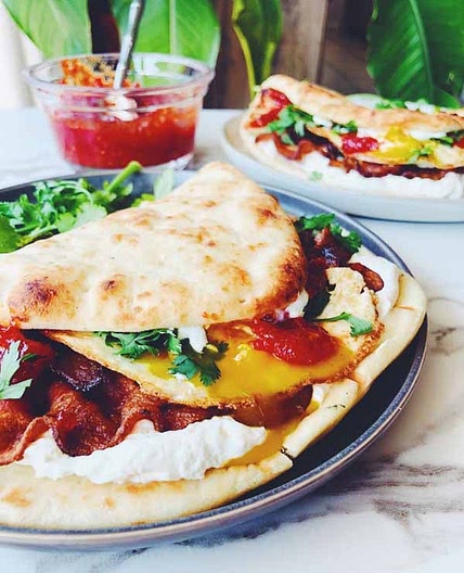 Dishoom's Naan Breakfast Sandwich with Bacon, Cream Cheese, Chili-Tomato Jam & Cilantro