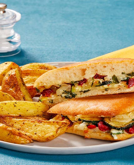 Zucchini & Sun-Dried Tomato Panini with Melty Mozz, Basil Sauce & Italian-Seasoned Potato Wedges