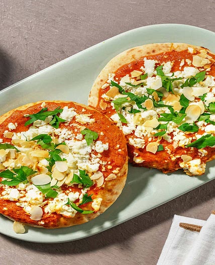 Loaded Pizza Style Harissa Flatbreads with Greek Style Cheese and Flaked Almonds | Perfect for sharing