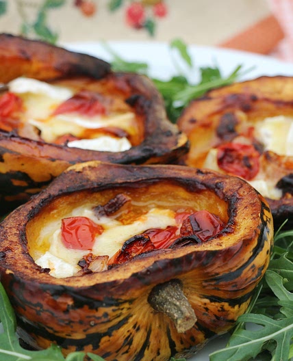 Baked winter squash with tomato, onion and camembert
