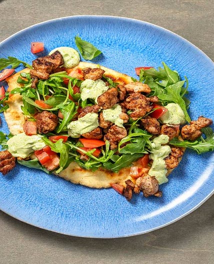 Chermoula Chicken Loaded Naan with Zhoug Yoghurt, Rocket and Tomato