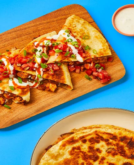 One-Pan Baja Chicken Quesadillas with Chicken Thighs, Salsa Fresca, Lime Crema & Hot Sauce