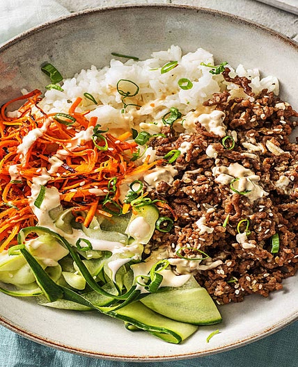 Beef Bulgogi Bowls with Carrots, Cucumber, and Sriracha Crema over Jasmine Rice
