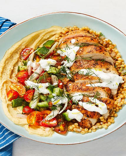 Chicken Gyro Couscous Bowls with Hummus, Tomato-Cucumber Salad, and Creamy Feta Sauce