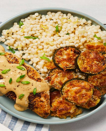Creamy Lemon Butter Chicken with Mozzarella Zucchini Rounds & Scallion Couscous