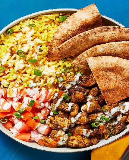 Street Cart-Style Chicken Bowls with Yellow Rice, White Sauce & Pita Wedges