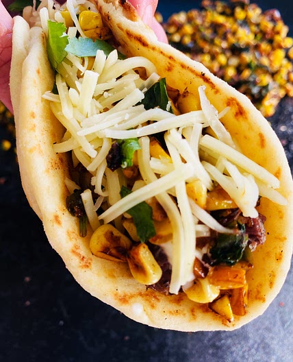 Blackstone Steak and Corn Naan Tacos