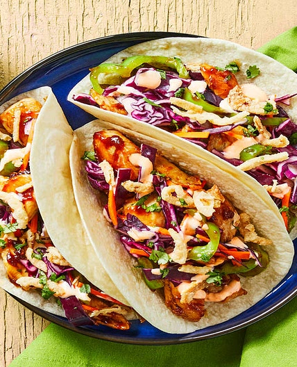 Chicken Stir-Fry Tacos with Tangy Cabbage Slaw, Green Pepper, Sriracha Mayo & Crispy Fried Onions