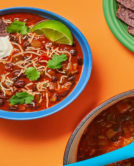 Hearty Black Bean & Poblano Soup with Blue Corn Tortilla Chips, Monterey Jack & Lime Sour Cream