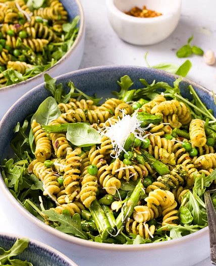 Pesto Pasta with Arugula, Asparagus, Peas, and Pistachios
