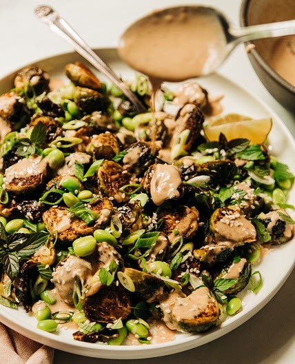 Crispy Roasted Brussels Sprouts with Edamame & Peanut Sauce