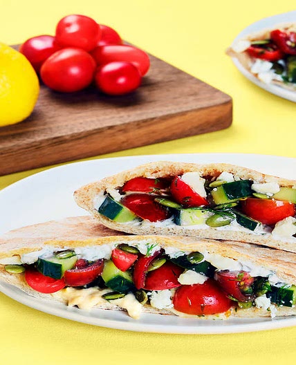 Cucumber Salad-Stuffed Pita Pockets with Hummus, Feta & Creamy Dill Sauce