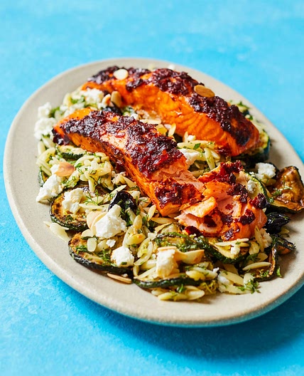 Harissa salmon with orzo courgette salad