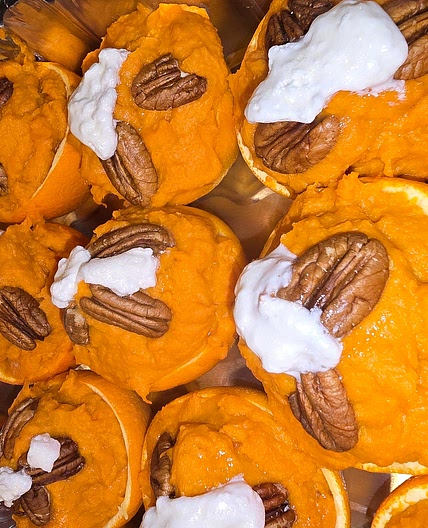Sweet potatoes in orange halves