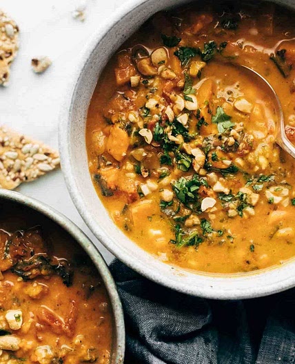 Spicy Peanut Soup with Sweet Potato + Kale