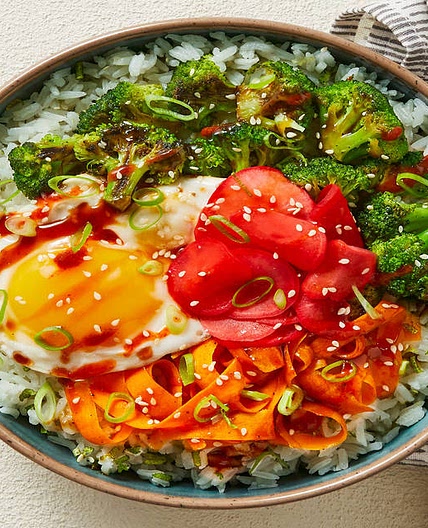 Broccoli-Carrot Donburi with a Fried Egg over Scallion Lime Rice with Pickled Radishes & Sesame Seeds